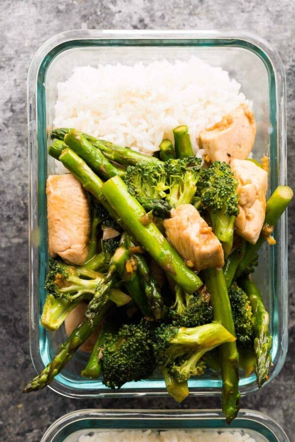 Prep this meal prep stir fry with two difference sauces (honey sriracha and lemon sesame) to get completely different flavors in your lunch! Prep them both in under 45 minutes.