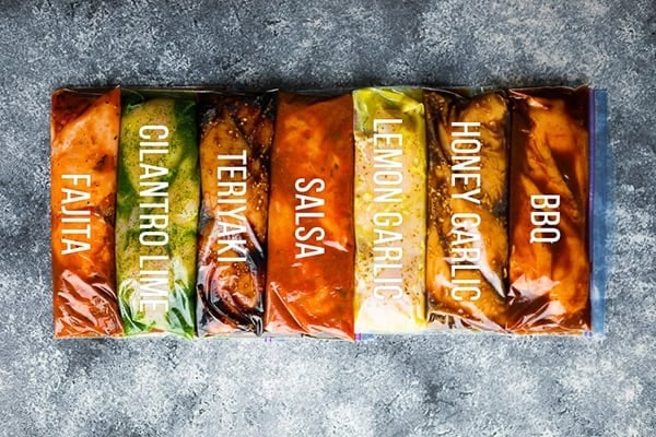 seven Crockpot Freezer Meals in ziploc bags with labels