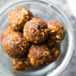 a glass bowl filled with no bake gingerbread oatmeal energy bites