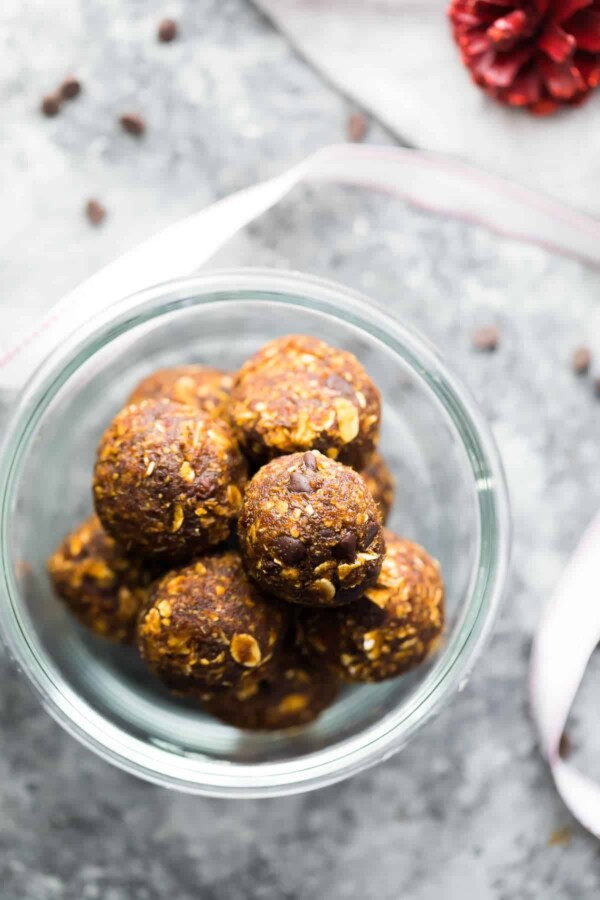 Pile of Gingerbread chocolate chip energy bites in a glass bowl