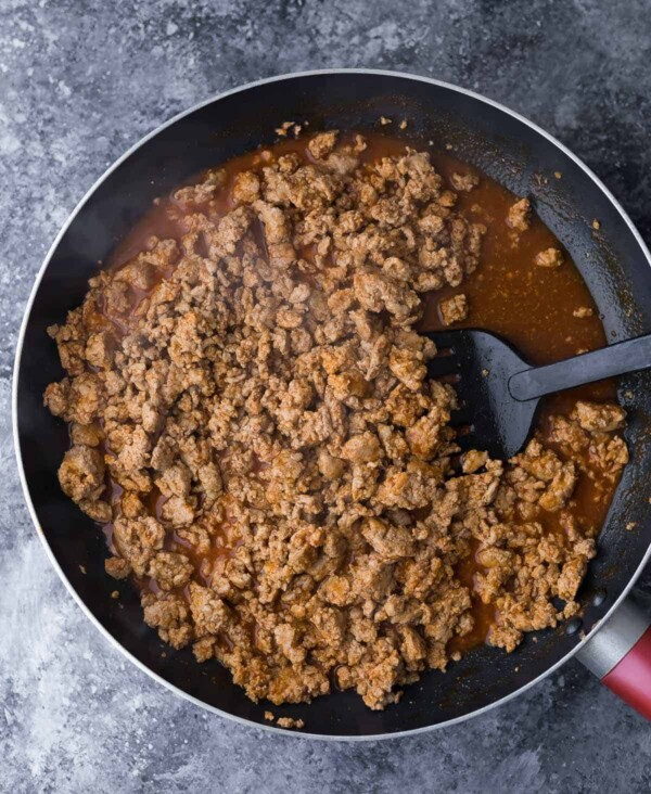 Lean ground turkey sauteed in a large pan with spatula