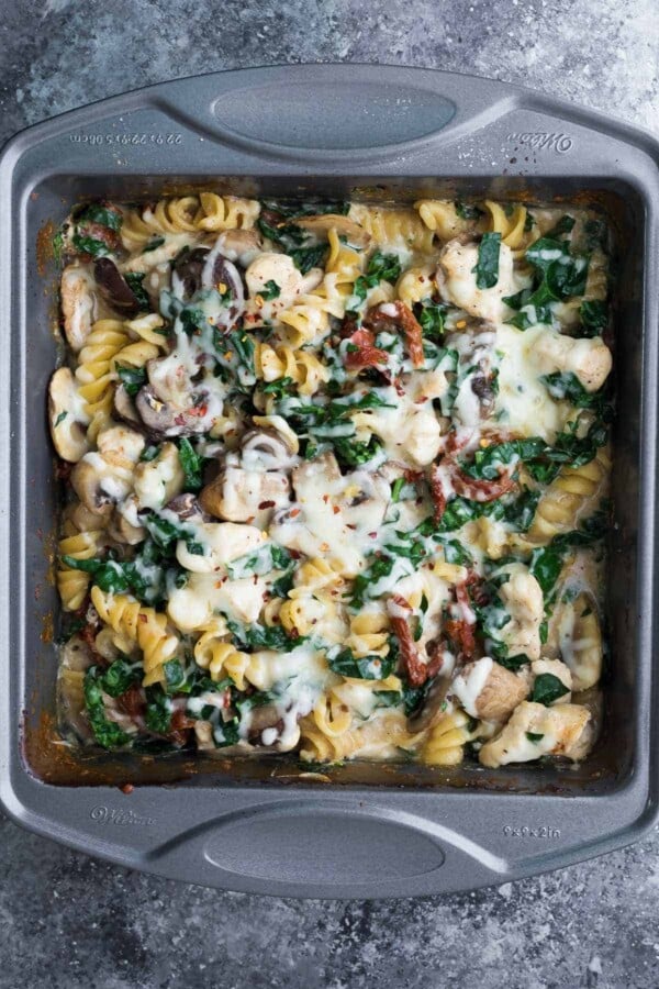 One pan Tuscan chicken pasta bake in baking pan after baking