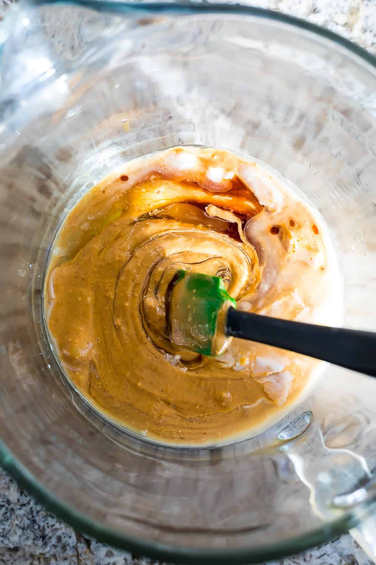 ingredients for Peanut Butter & Jam Breakfast Cookies in glass bowl