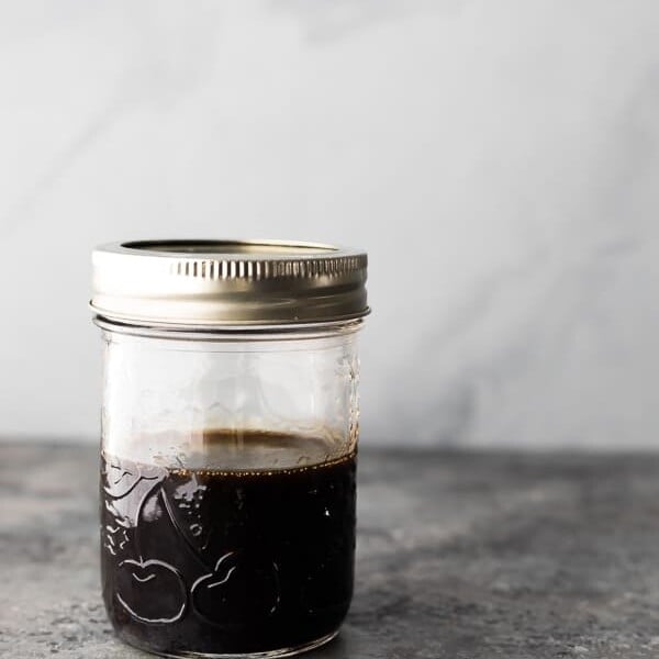 A mason jar filled with the 4 ingredient balsamic vinaigrette