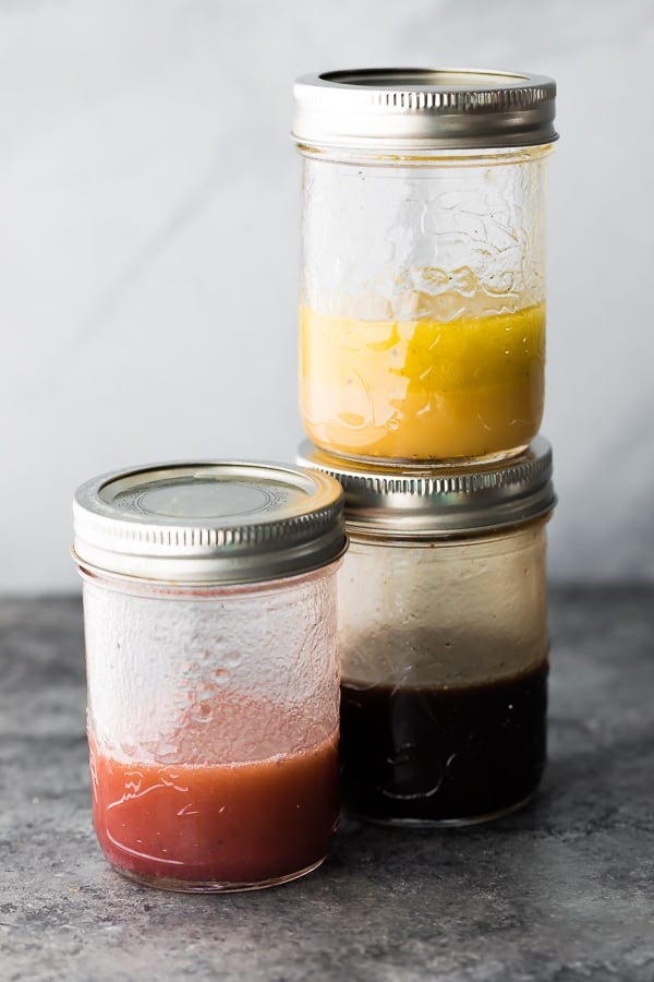 red wine vinaigrette, white wine vinaigrette and balsamic vinaigrette in mason jars