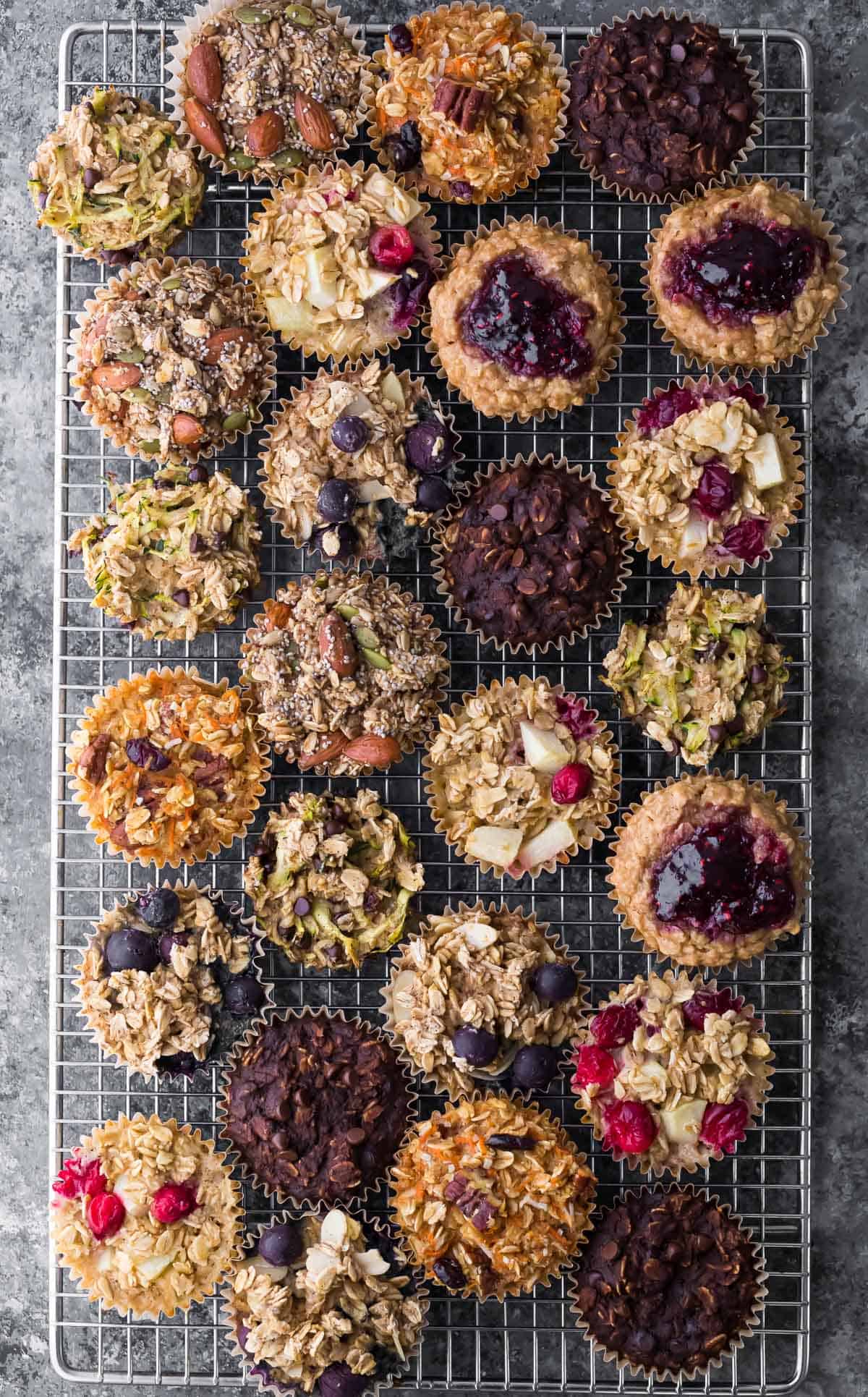 overhead shot of a variety of baked oatmeal cups on wire rack