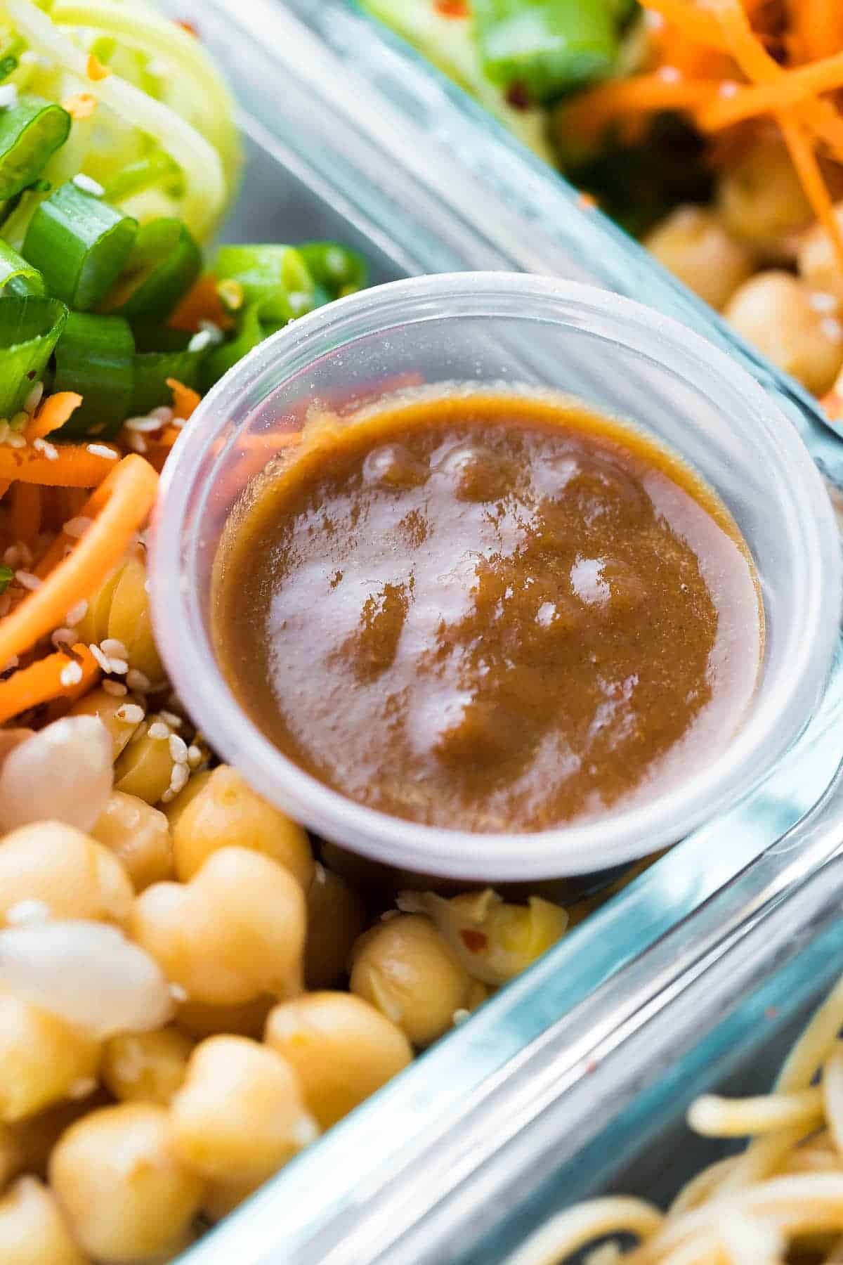 close up shot of the sauce and chickpeas in Cold Sesame Noodle Meal Prep Bowls