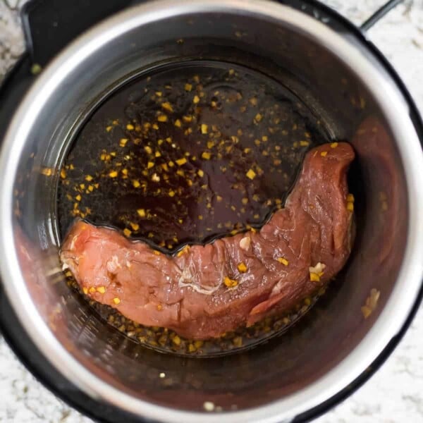 overhead view of uncooked pork tenderloin in the Instant Pot