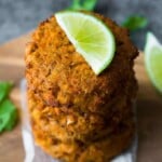 stack of thai salmon patties with lime wedge on top