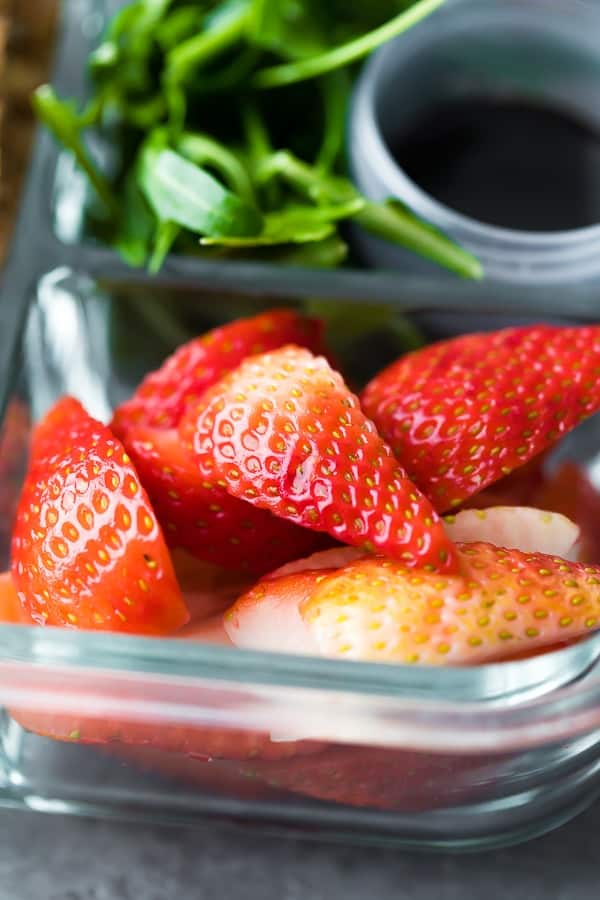 close up shot of the stawberries and spinach in bento lunch box