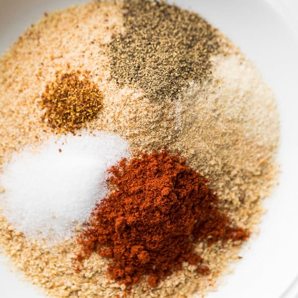 overhead view of a bowl with breadcrumbs and spices for breading chicken tenders