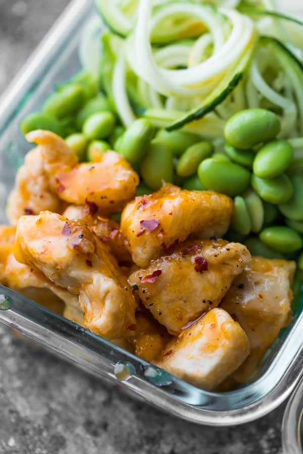 Healthier firecracker chicken sauce on chicken in meal prep containers