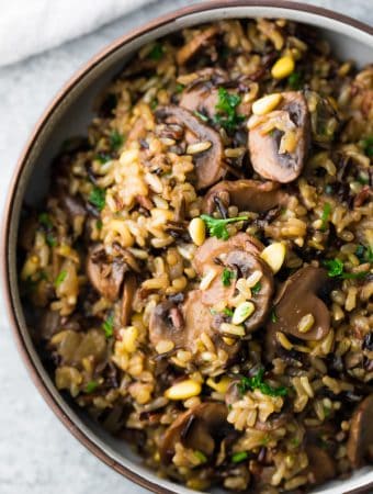 closeup shot of wild rice pilaf with mushrooms and pine nuts