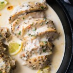 overhead shot of lemon garlic chicken breasts in the instant pot with lemon slices