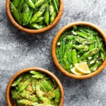 overhead shot of three brown bowls filled with sugar snap peas in various recipes