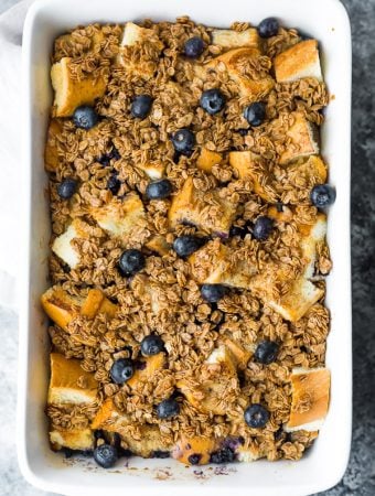 Overhead shot of blueberry overnight french toast bake in white baking dish