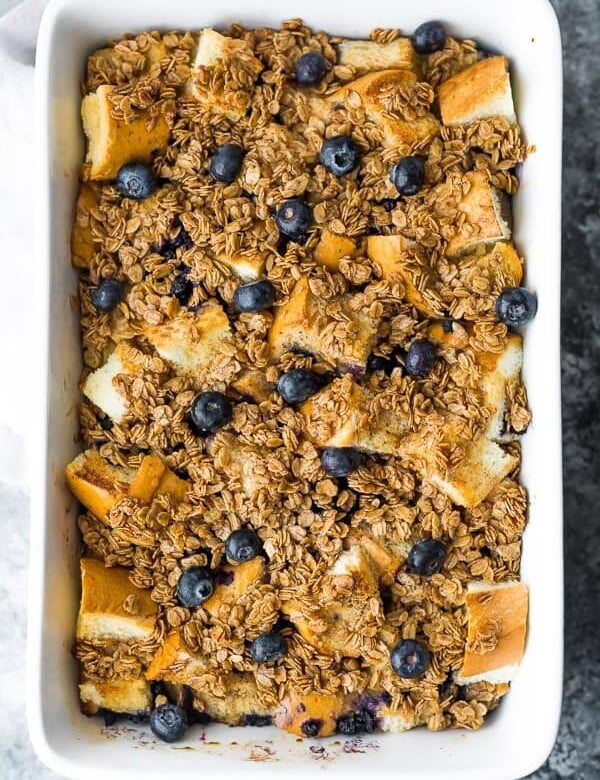 Overhead shot of blueberry overnight french toast bake in white baking dish