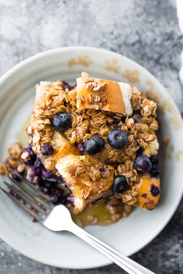 a scoop of the overnight french toast recipe on a plate with a fork