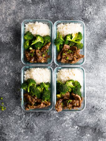 overhead shot of four mongolian beef and broccoli meal prep bowls