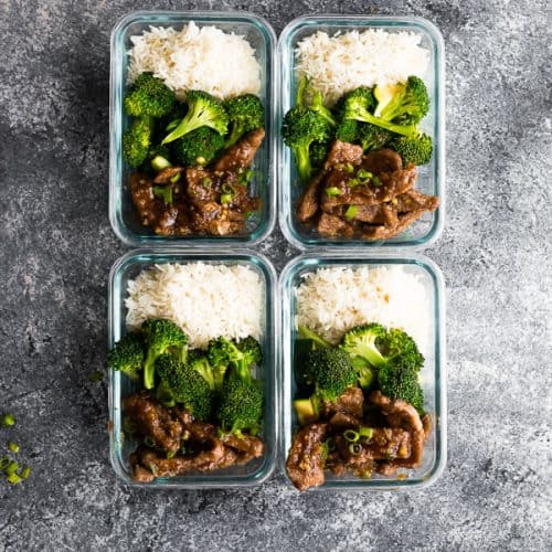 overhead shot of four mongolian beef and broccoli meal prep bowls