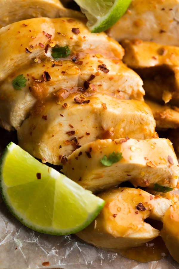 close up shot of Instant Pot Chipotle Lime Chicken Breasts sliced with lime wedge