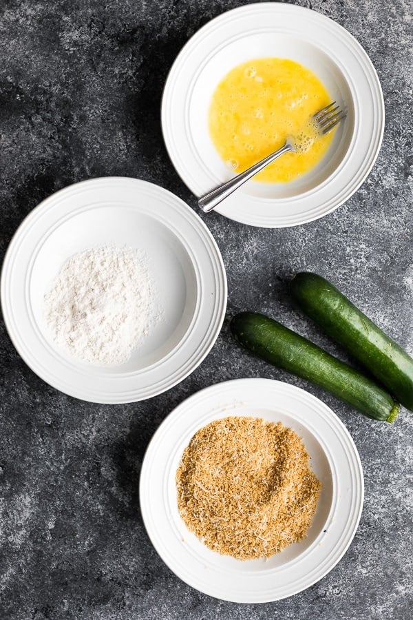 ingredients for the Air Fryer Zucchini Fries, 3 bowls plus the zucchinis