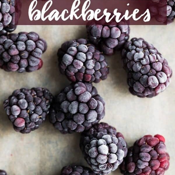 frozen blackberries on wood cutting board