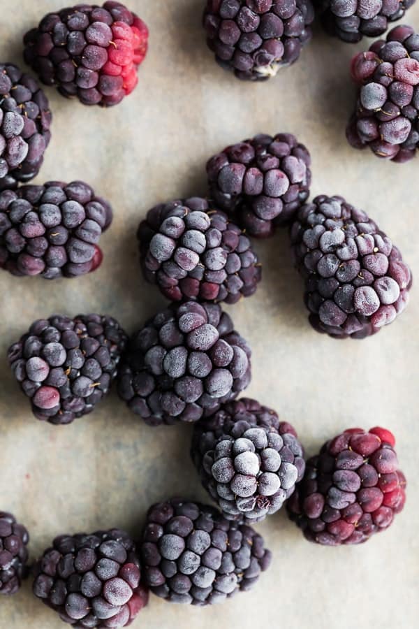 frozen blackberries on baking sheet