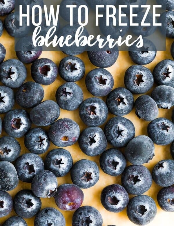 overhead shot of blueberries on wood cutting board