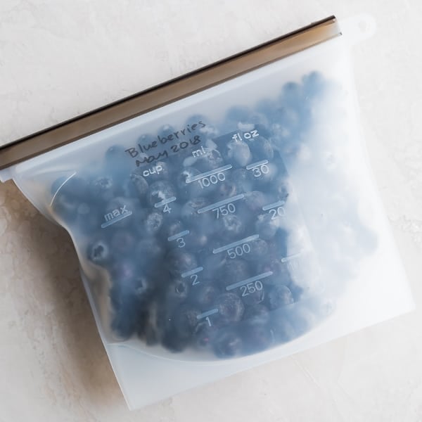 side view of the blueberries in reusable freezer bag with label
