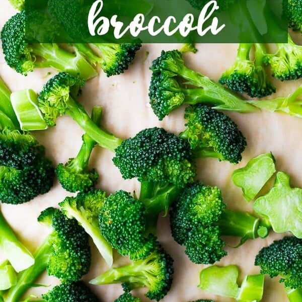 A bunch of broccoli on wood cutting board