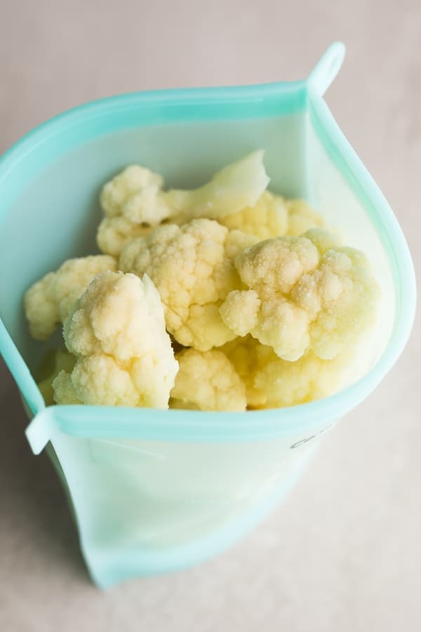 cauliflower florets in a reusable freezer bag