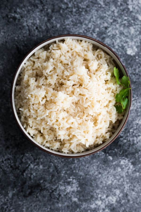 overhead shot of coconut rice recipe in brown bowl