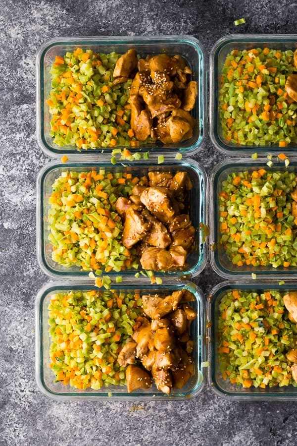 overhead shot of six glass meal prep containers filled with Broccoli Rice Teriyaki Chicken 