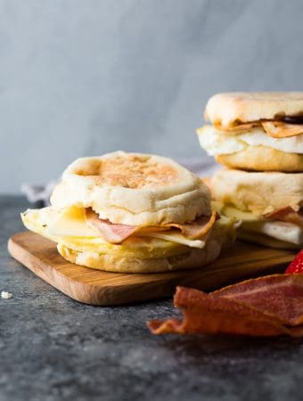 three copycat starbucks egg white breakfast sandwiches on wood board