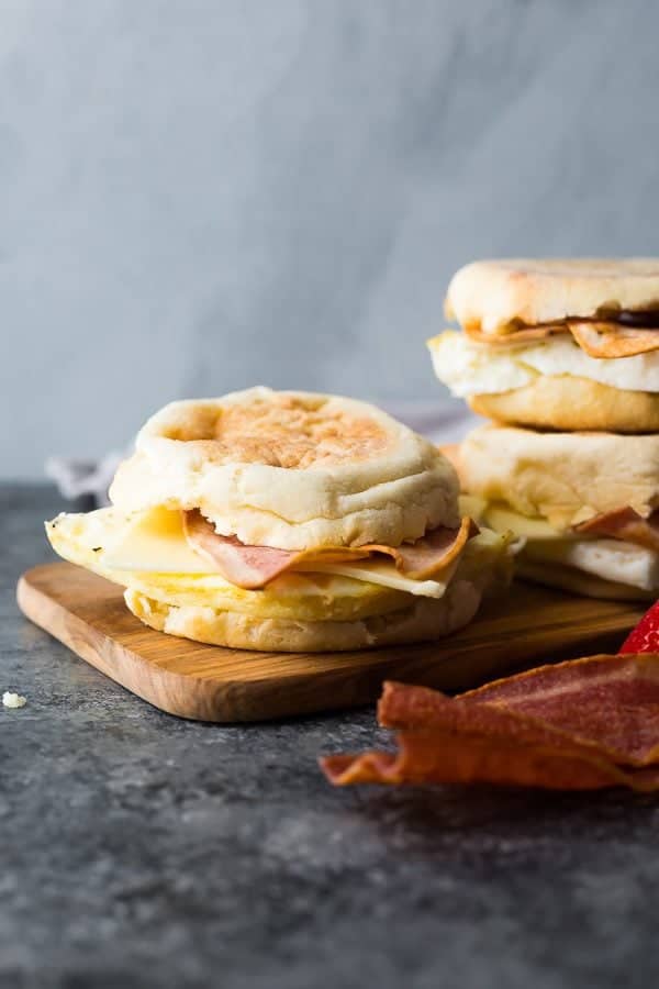 three copycat starbucks egg white breakfast sandwiches on wood board