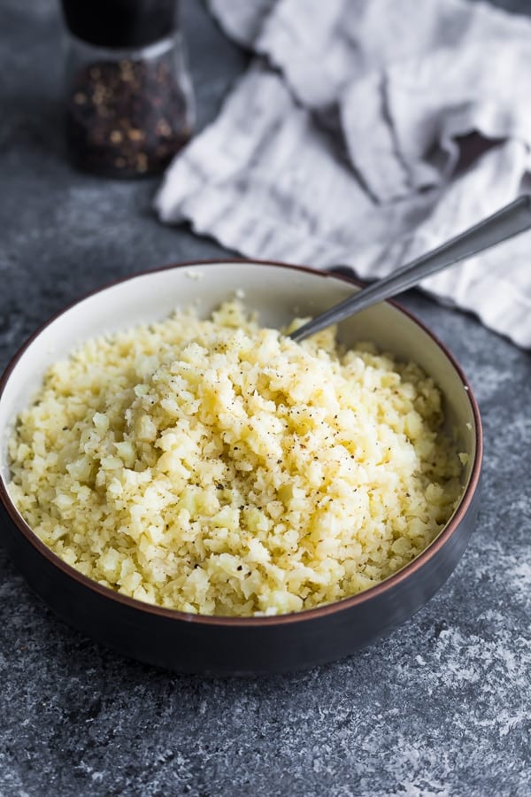 bowl of cauliflower rice with a fork