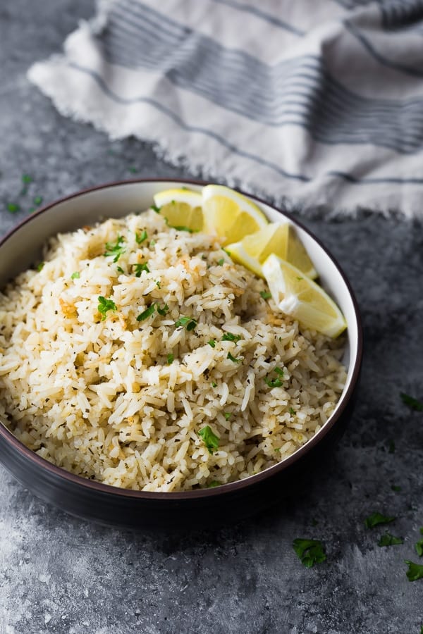 Herb Lemon Rice Recipe in brown bowl with blue striped napkin