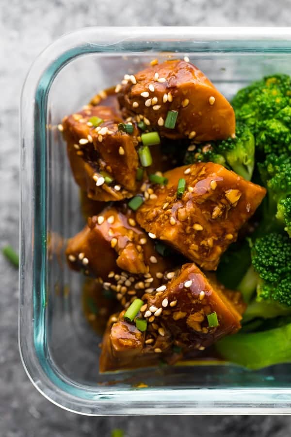 close up of crock pot teriyaki chicken in meal prep container