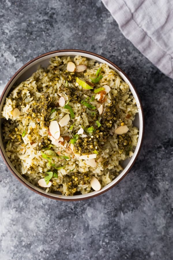 pesto green rice in brown bowl