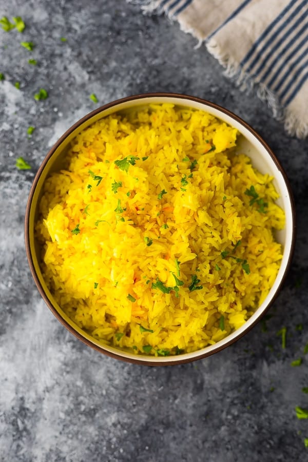 overhead shot of saffron rice in large bowl