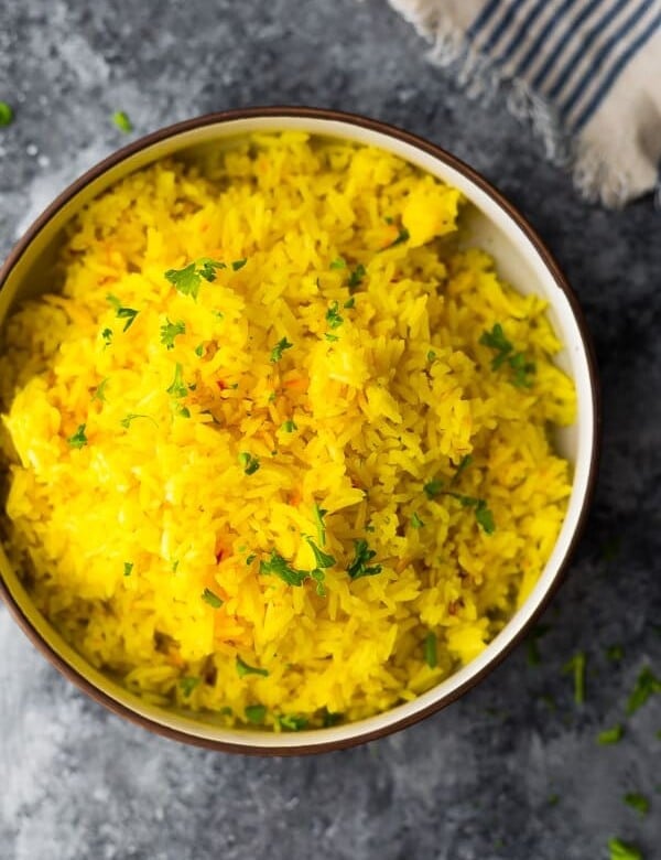 overhead shot of saffron rice in large bowl