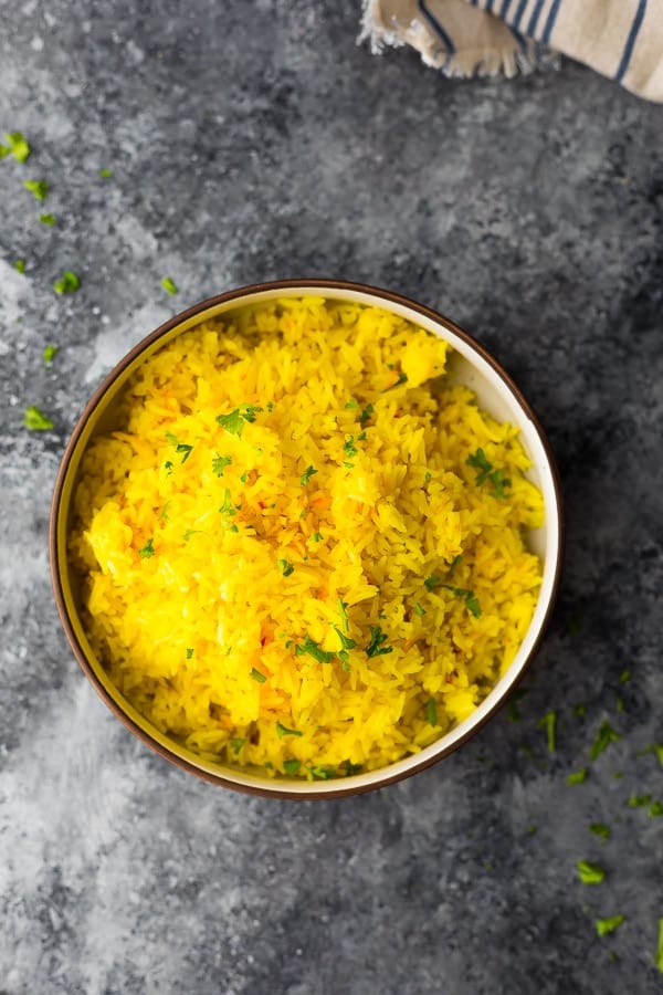 bowl of saffron basmati rice on grey background