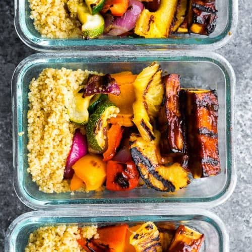 overhead shot of three glass meal prep containers with pineapple bbq tofu