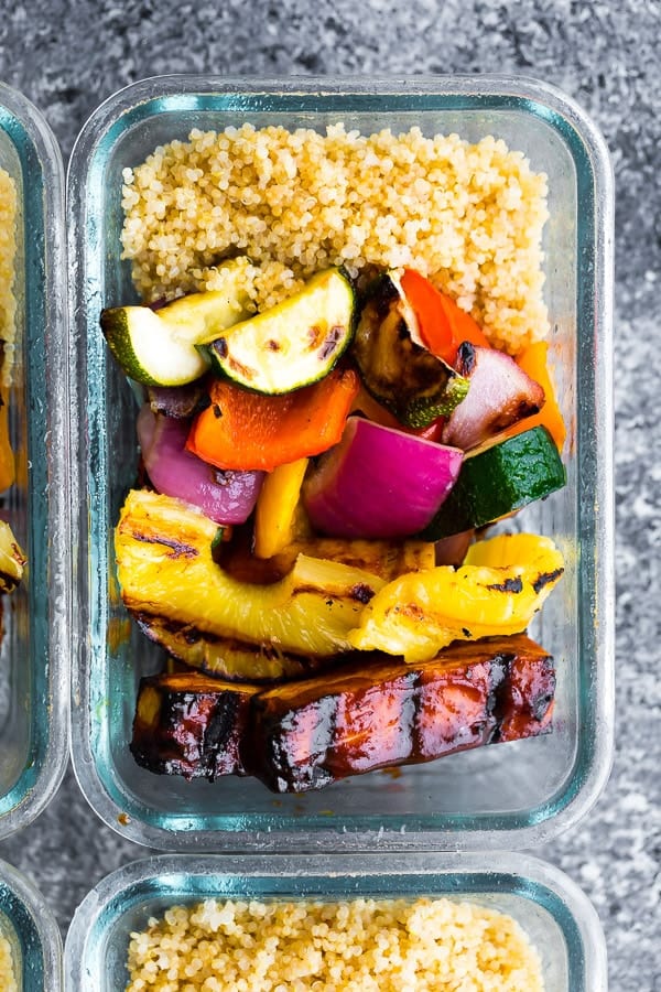 overhead shot of the Pineapple BBQ Tofu meal prep in glass storage container