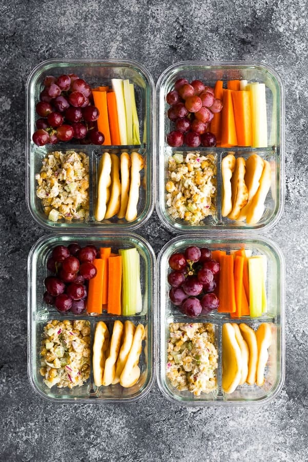 overhead view of the Chickpea Salad Bento Box with flatbread, vegetables and grapes