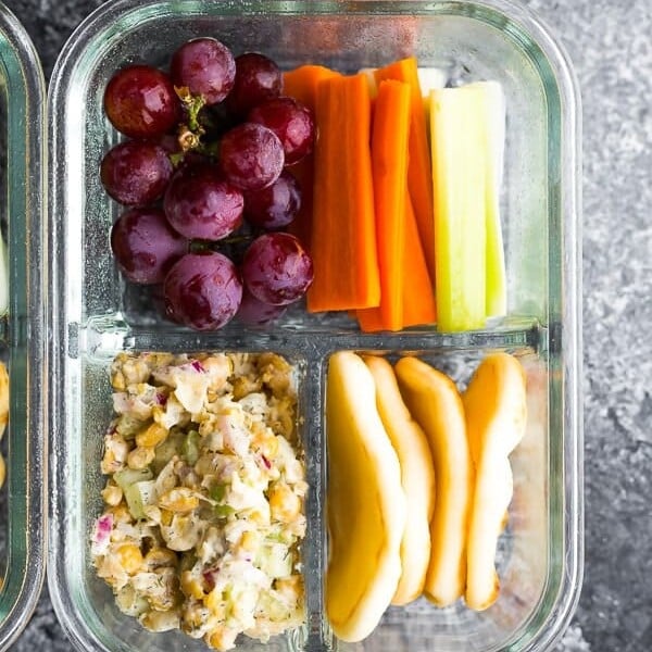 overhead shot of glass meal prep container with chickpea salad bento box