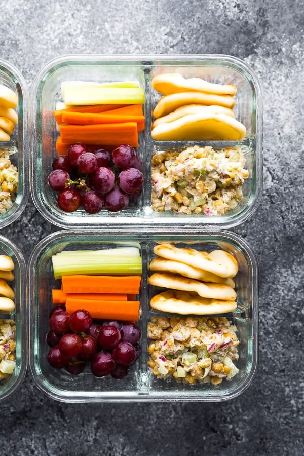 overhead view of the Chickpea Salad Bento Box with flatbread, vegetables and grapes