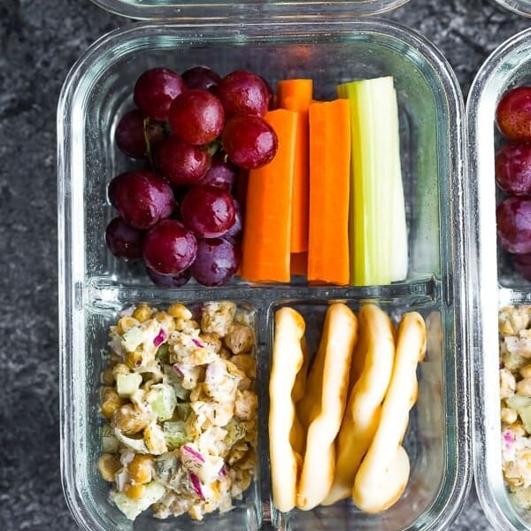 overhead shot of chickpea salad bento box in glass meal prep container