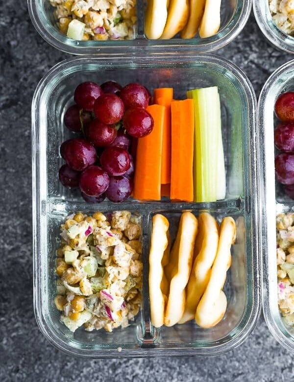 overhead shot of chickpea salad bento box in glass meal prep container